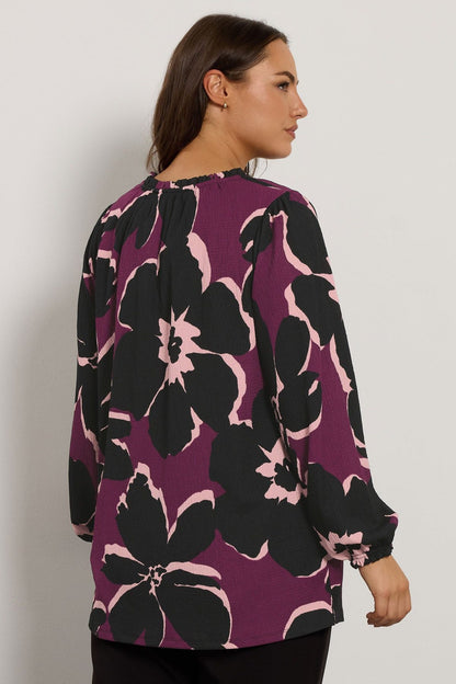 Lange Bluse mit Blumenmuster in großen Größen und Bindekragen