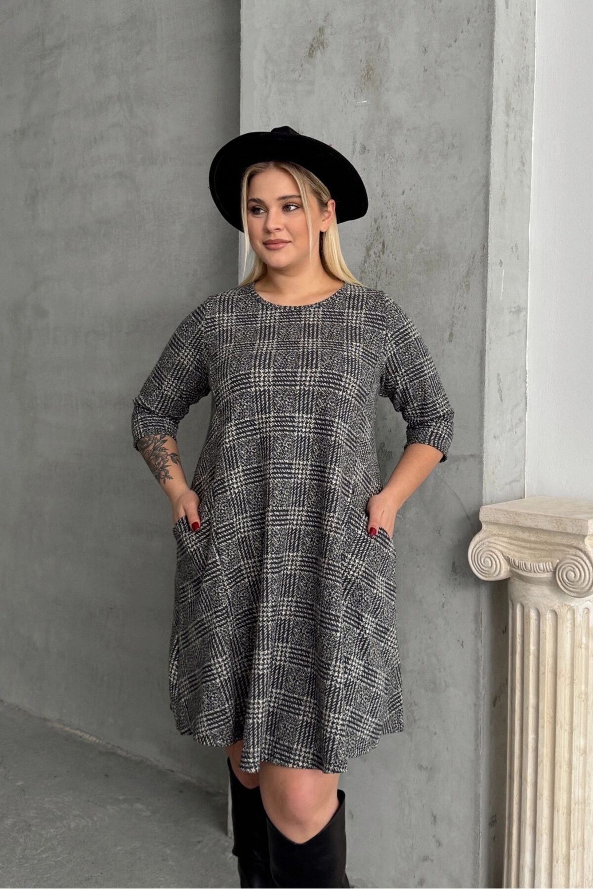 Plus-Size-Kleid mit kurzen Ärmeln, Rundhalsausschnitt, asymmetrischem Schnitt und Taschen