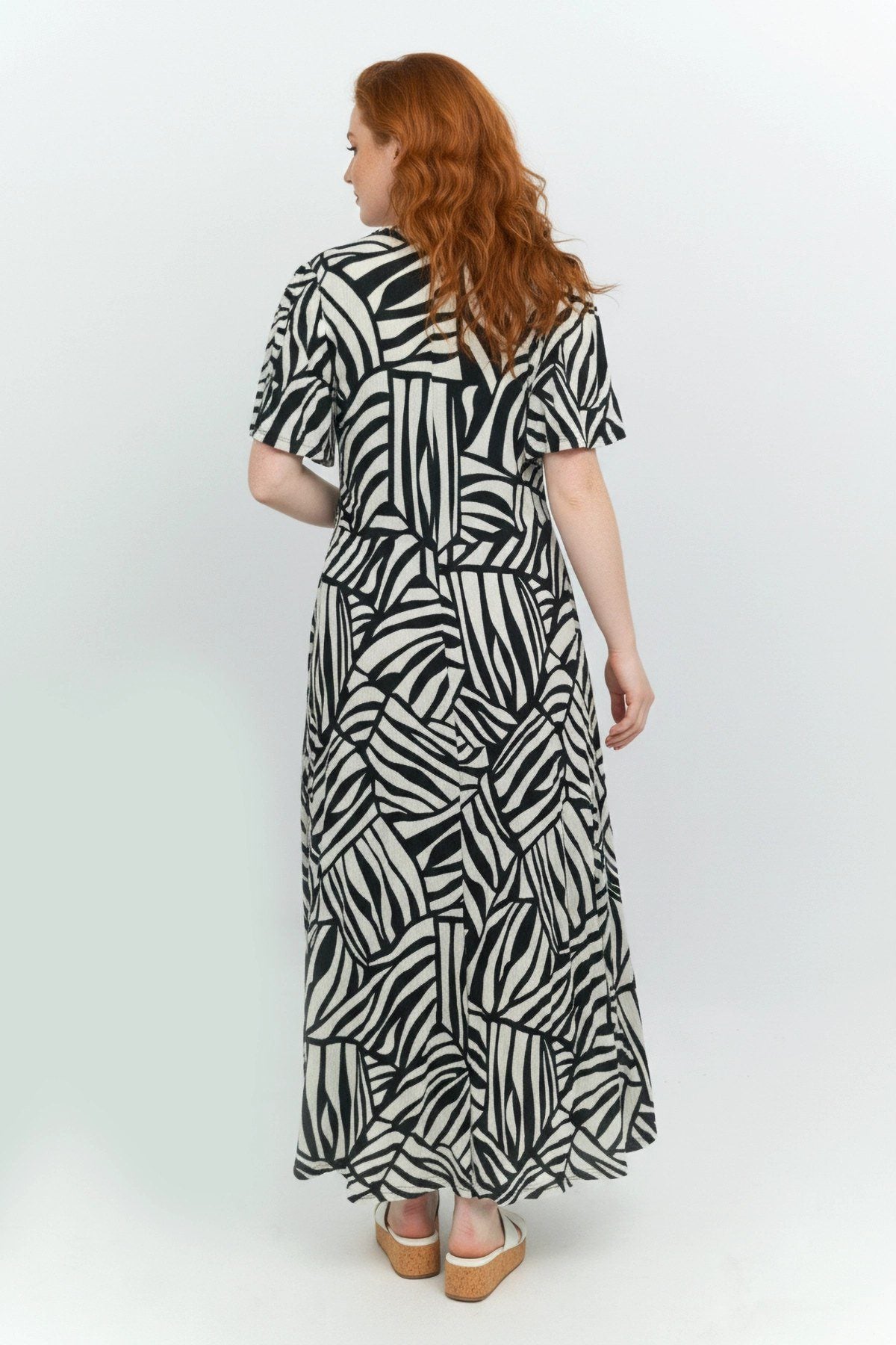 Muster Kleid mit Wickelkragen