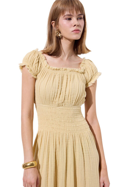 Rüschenkleid aus Musselin, beige