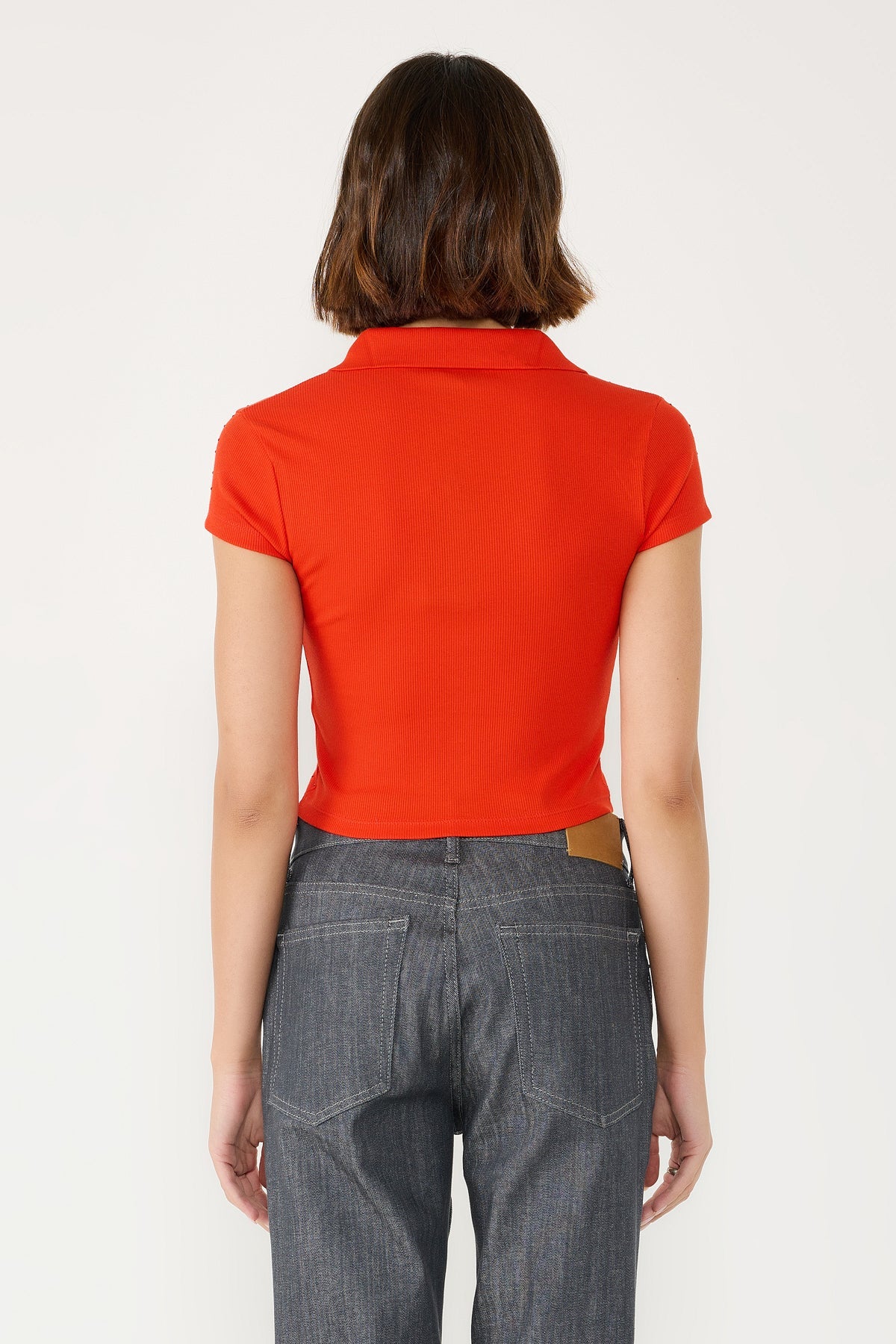 Polo-Shirt mit aufwendiger Strassverzierung auf der Vorderseite