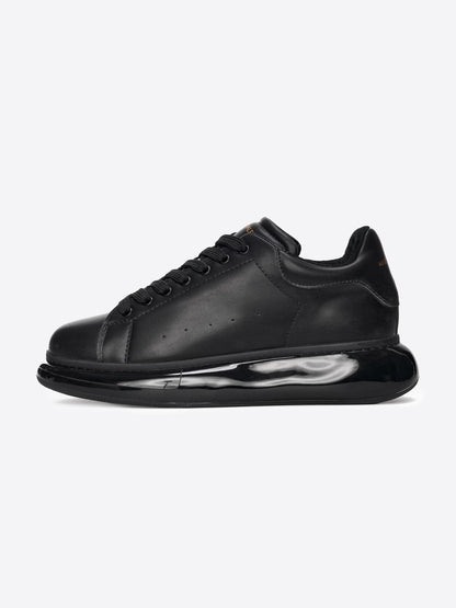 Sportschuhe mit Ballonsohle – Schwarz